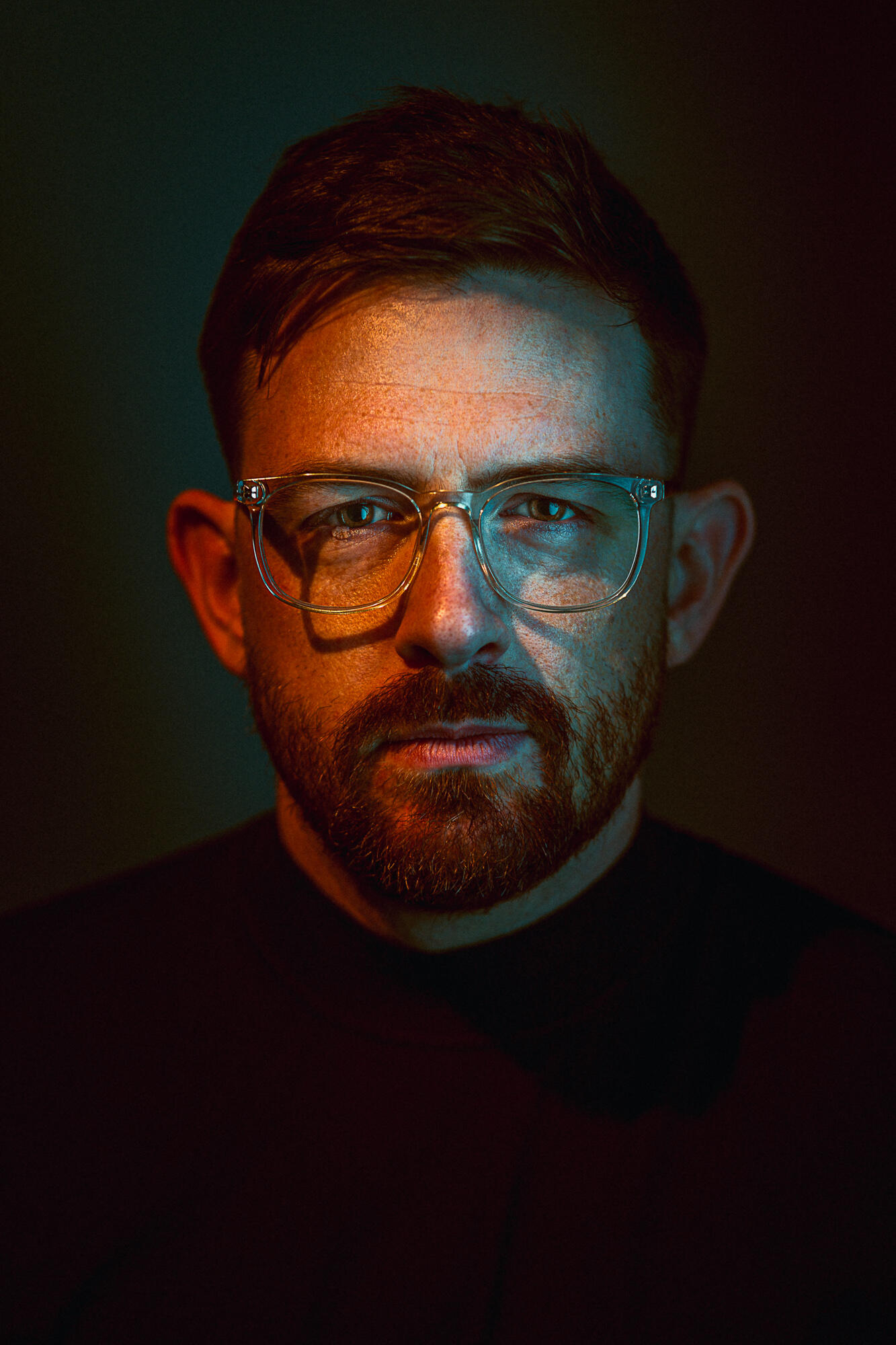 Jackson Ryan, Journalist An image of Jackson Ryan wearing a Protest the Hero long-sleeve black T-shirt and a black cap.